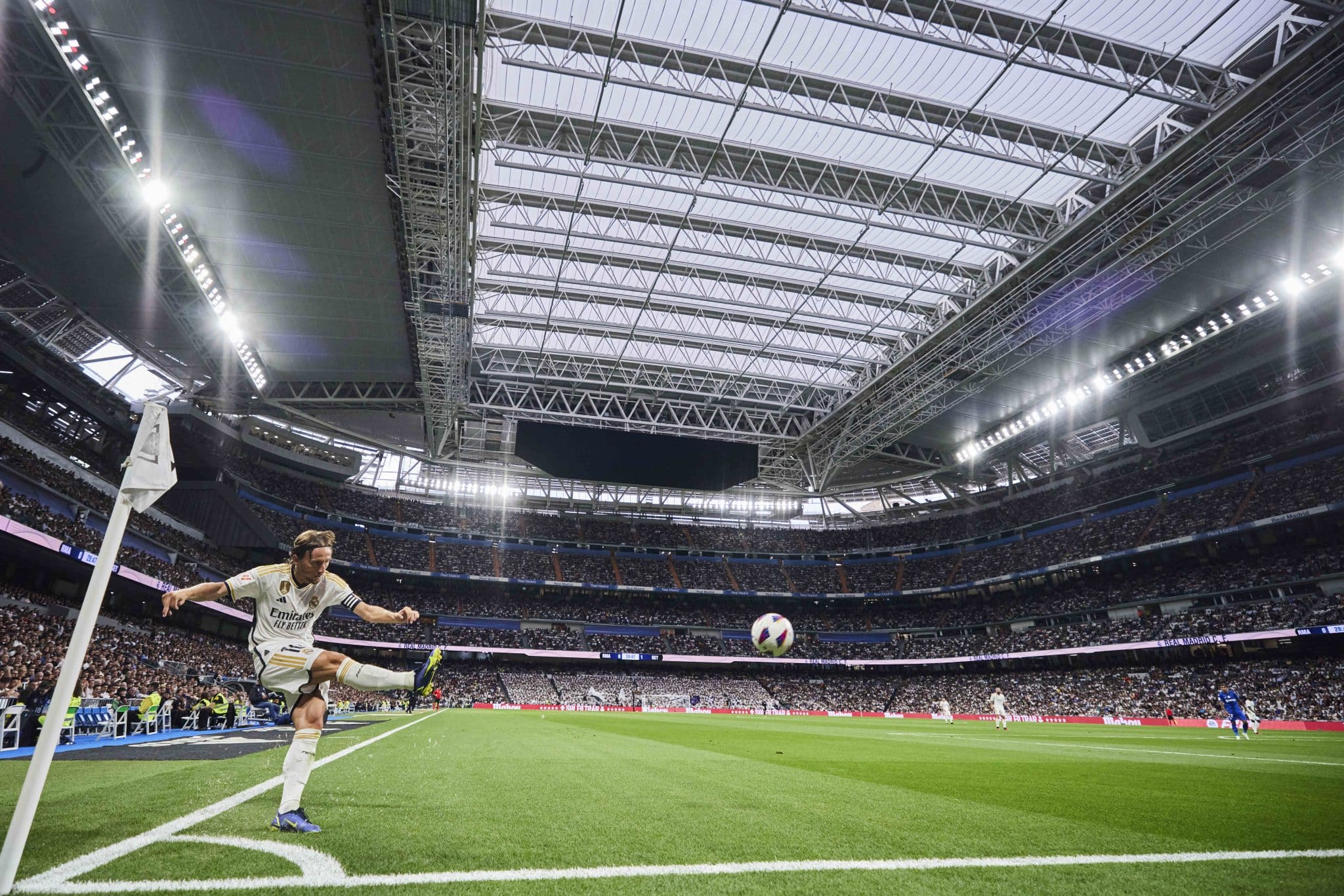 Real Madrid Stadium Renovation | Luka Modric takes a corner at the new Santiago Bernabeu under the retractable roof | The Santiago Bernabeu could host the 2030 World Cup final