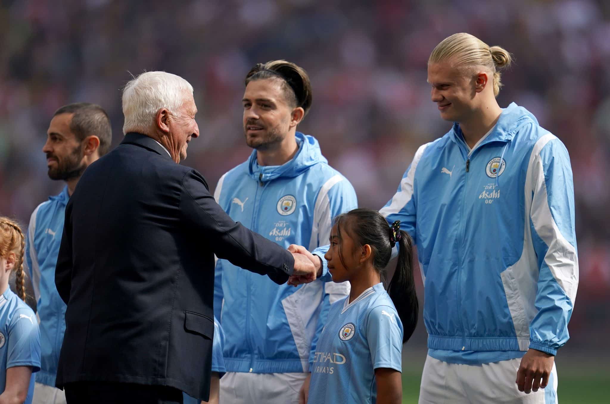 Manchester City statue: Club to unveil Lee-Bell-Summerbee statue 2 Mike Summerbee with Jack Grealish and Erling Haaland | Mike Summerbee will be featured in a new Manchester City statue at the Etihad Stadium in 2023