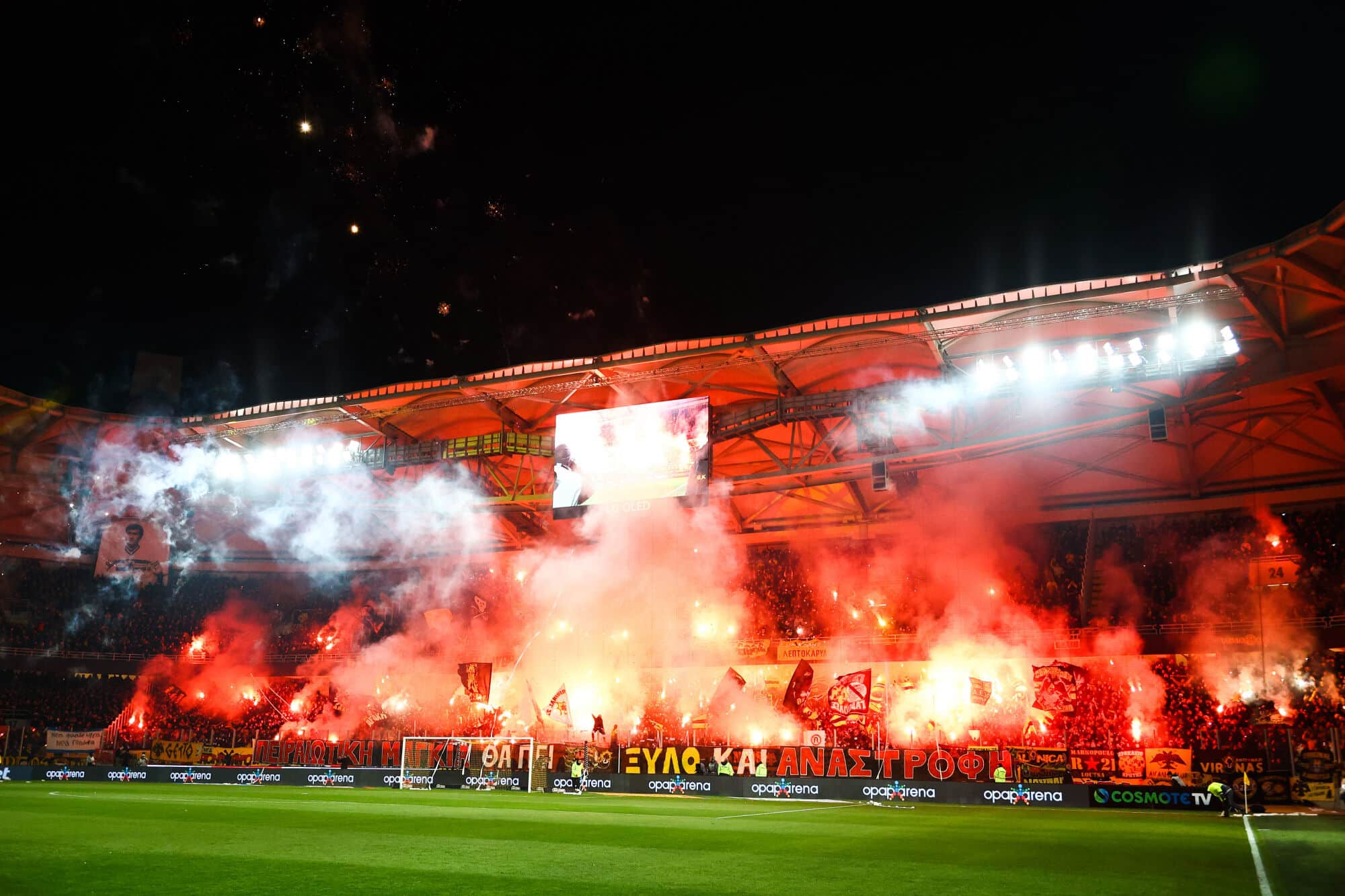 AEK Athens away section: Guide for Brighton fans 1 AEK Athens fans light up red flares during the Greek Cup Semi-Final First Leg match at OPAP Arena, Athens | Guide for AEK Athens away section