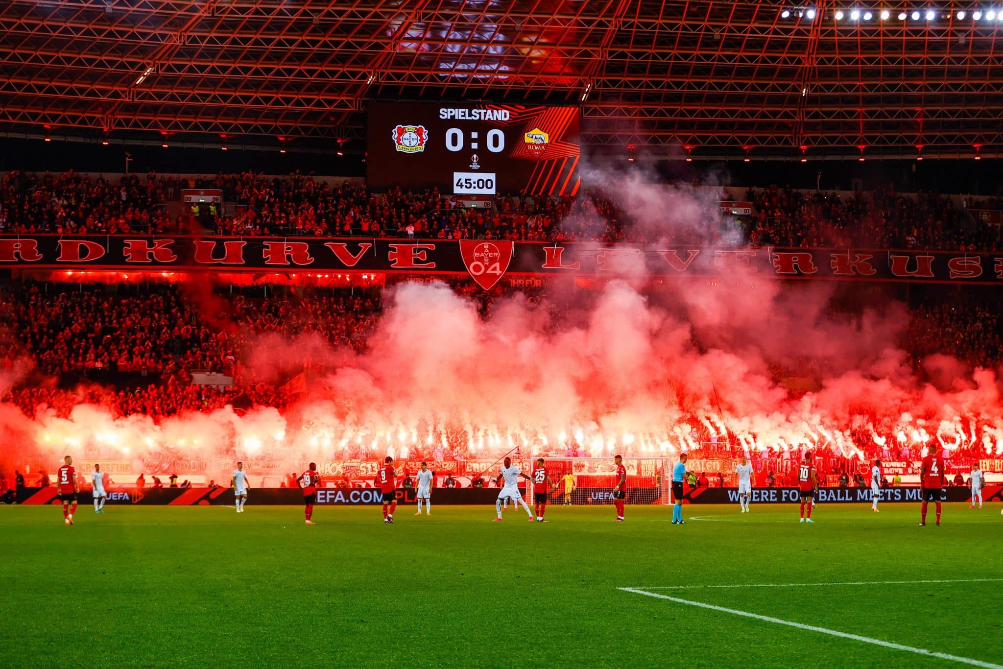 fans of Leverkusen burning off pyrotechnics during the 1. Europa League semi-final between Bayer 04 Leverkusen vs AS Roma at BayArena on May 18, 2023 in Leverkusen, Germany | Scottish football pyro problem
