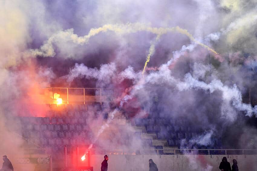 FIFPRO report finds workplace safety is a growing concern in football 1 Lazio and Roma fans throw flares and smoke grenades at each other during the Italy cup football match between SS Lazio and AS Roma