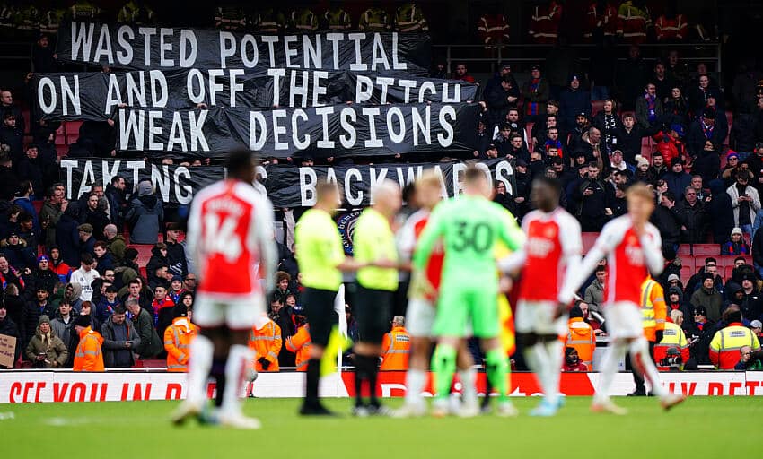 Roy Hodgson responds as Crystal Palace fans hit out at owners 1 Crystal Palace fans hold a banner in the stands after the final whistle following the Premier League match at the Emirates Stadium