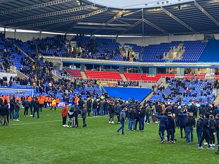 Reading fans invade the pitch during the Sky Bet League One match at the Select Car Leasing Stadium