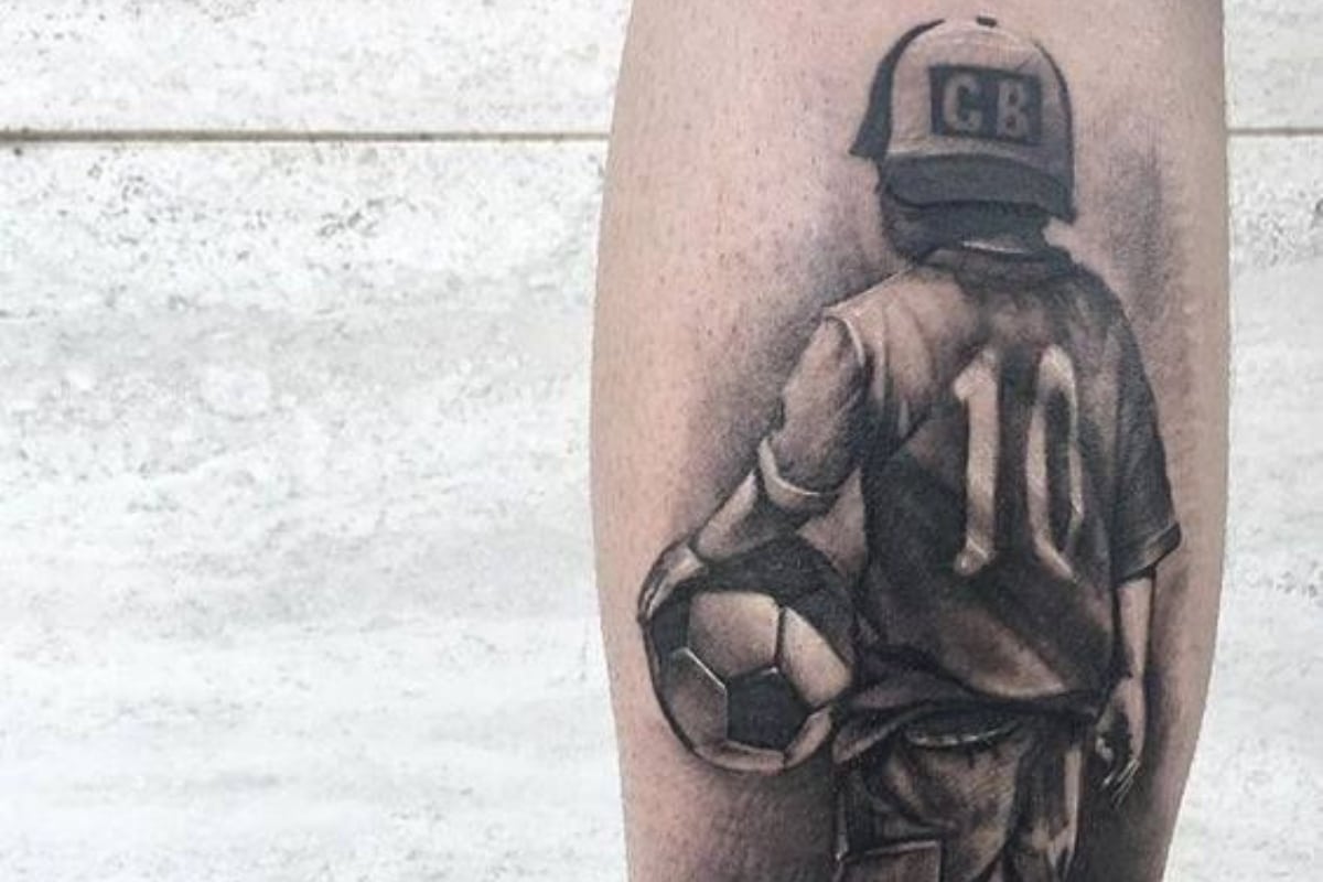 boy with a ball tattoo