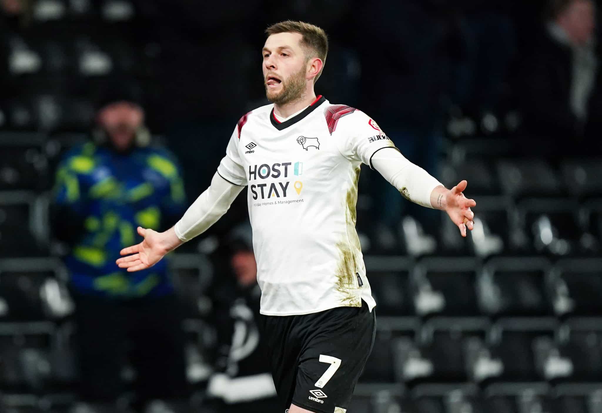 Derby fans on the pitch as they secure promotion back to the Championship 1 Derby fans on the pitch.