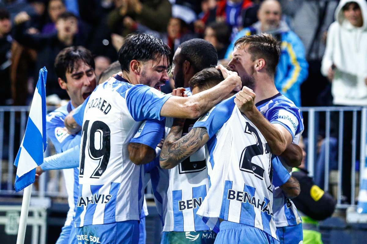 Malaga fans gather at airport