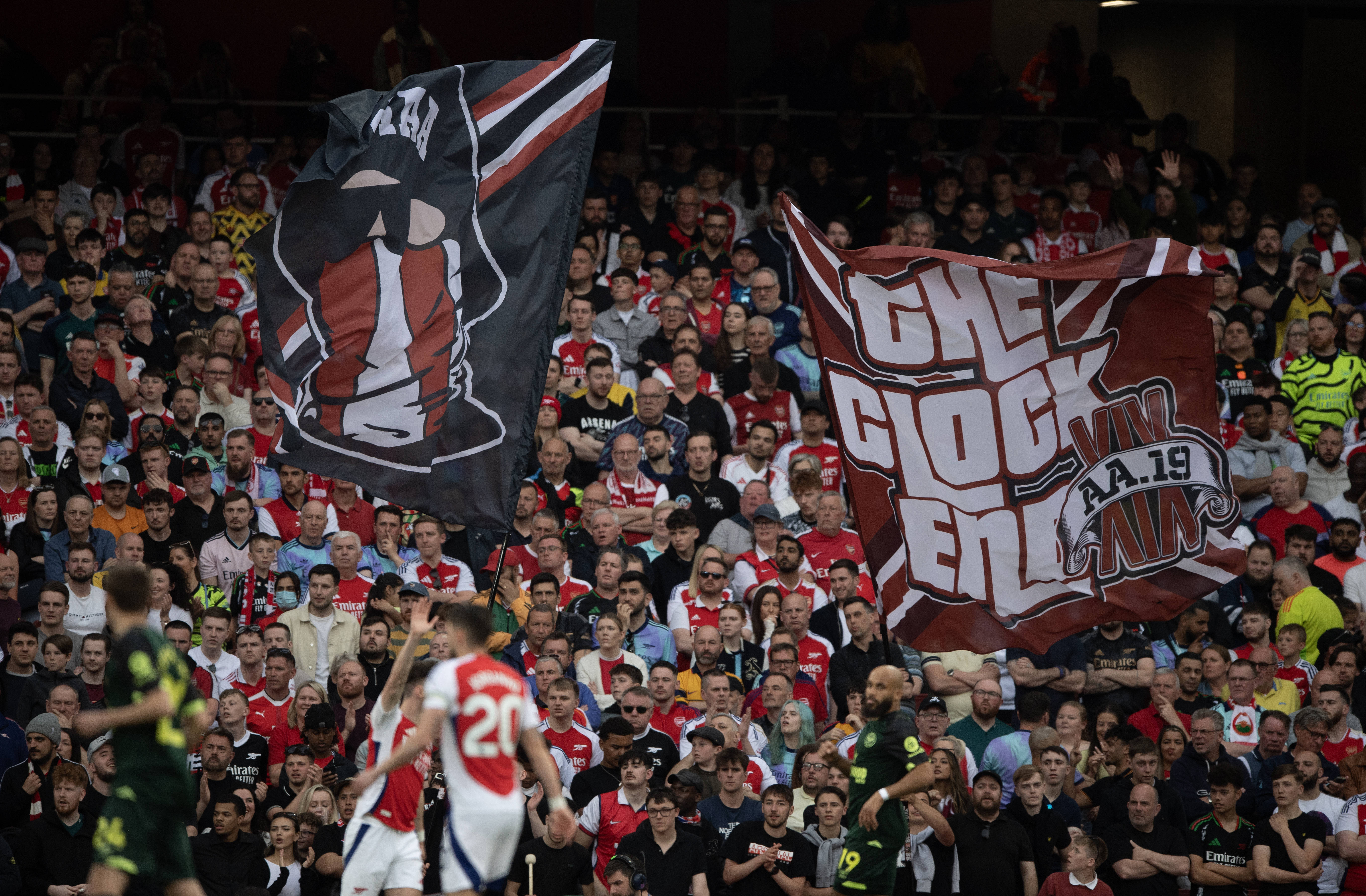 Arsenal Ultras waving flags in the Clock End