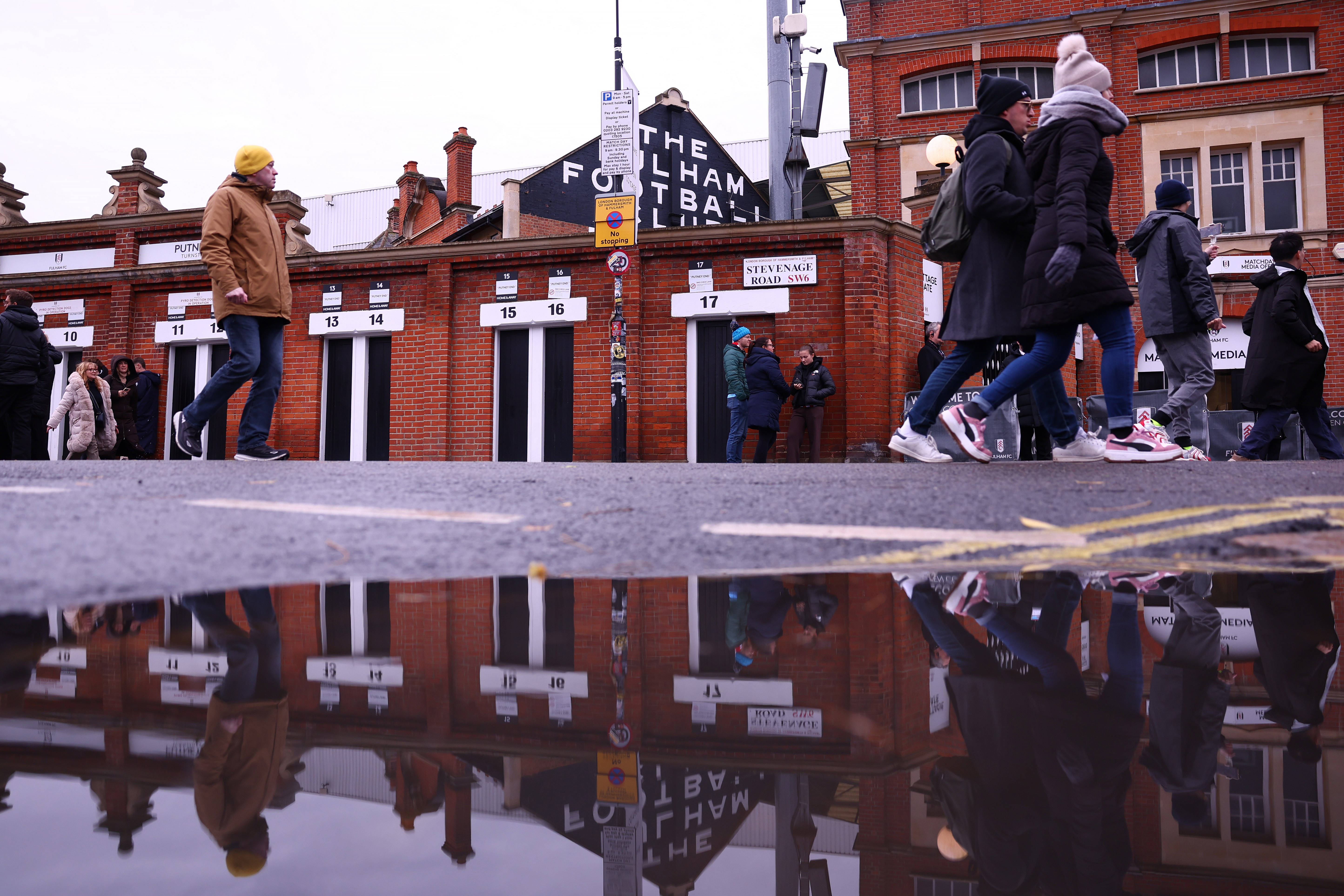 A general view outside Craven Cottage as fans make their way inside