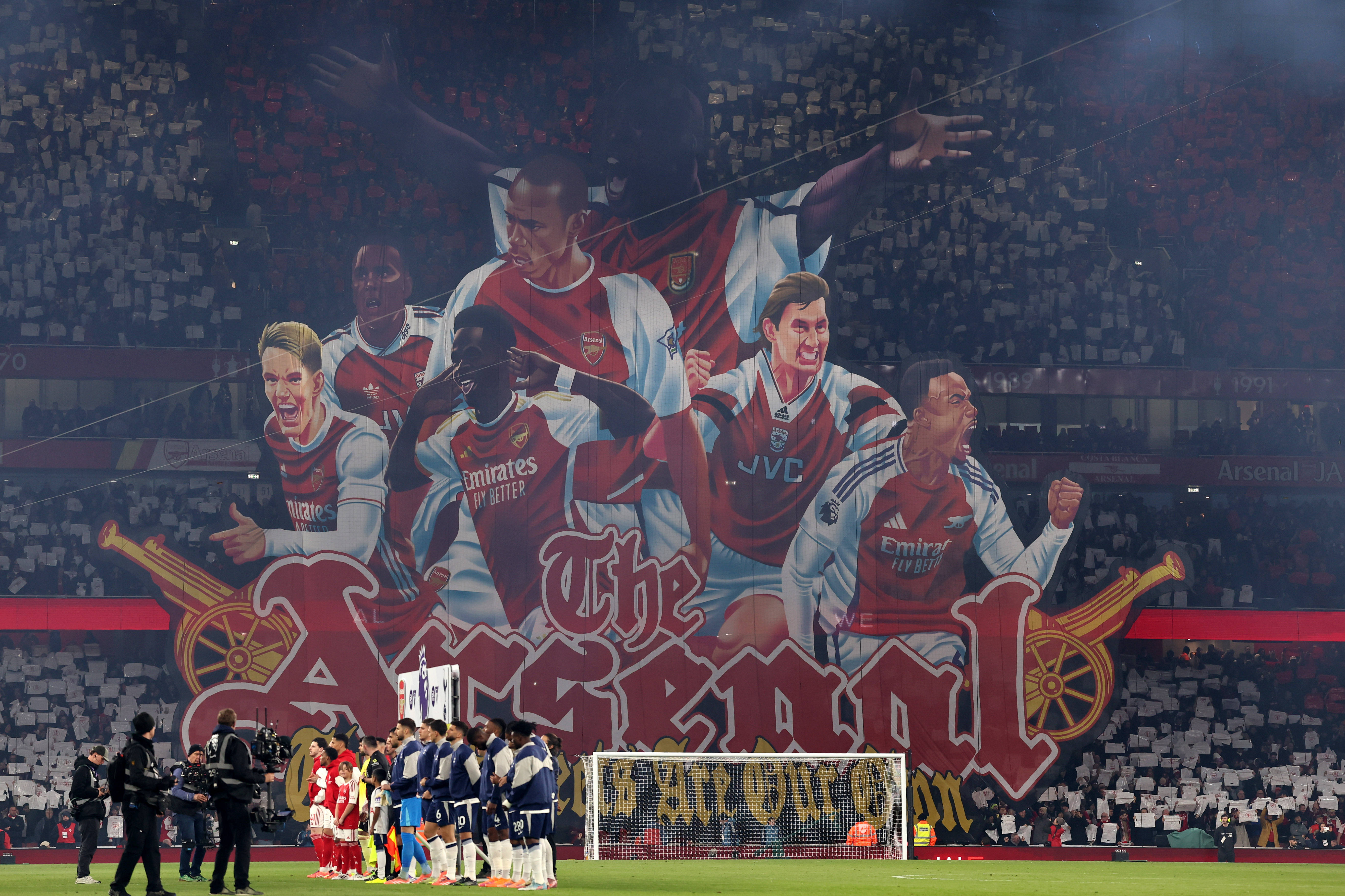 A tifo showing past and present Arsenal stars is unveiled before North London Derby vs Tottenham