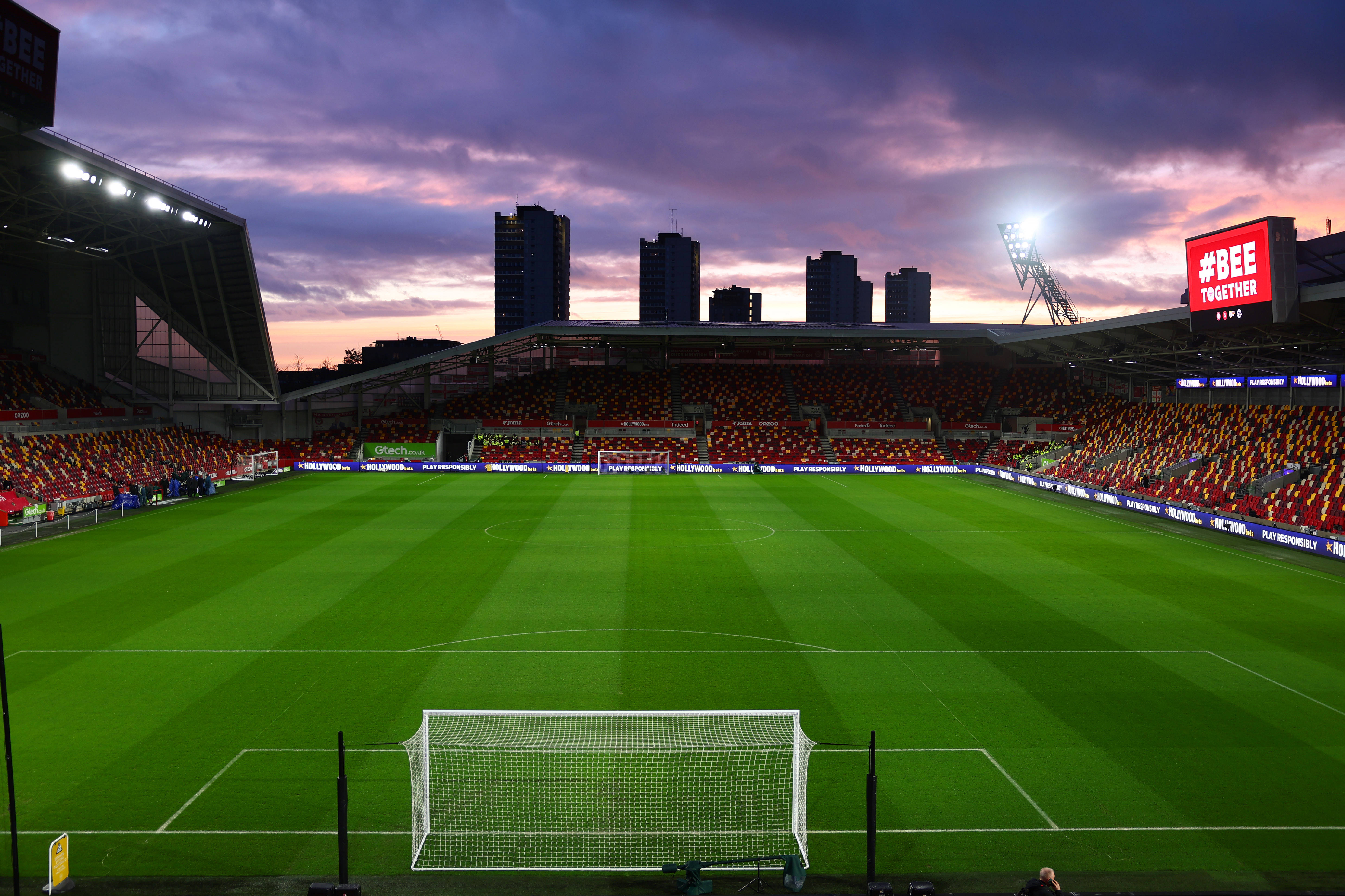 Where to Eat and Drink Near Gtech Community Stadium 2026: Best Pubs and Restaurants for Fans 1 A view inside the Gtech Community Stadium with a sunset