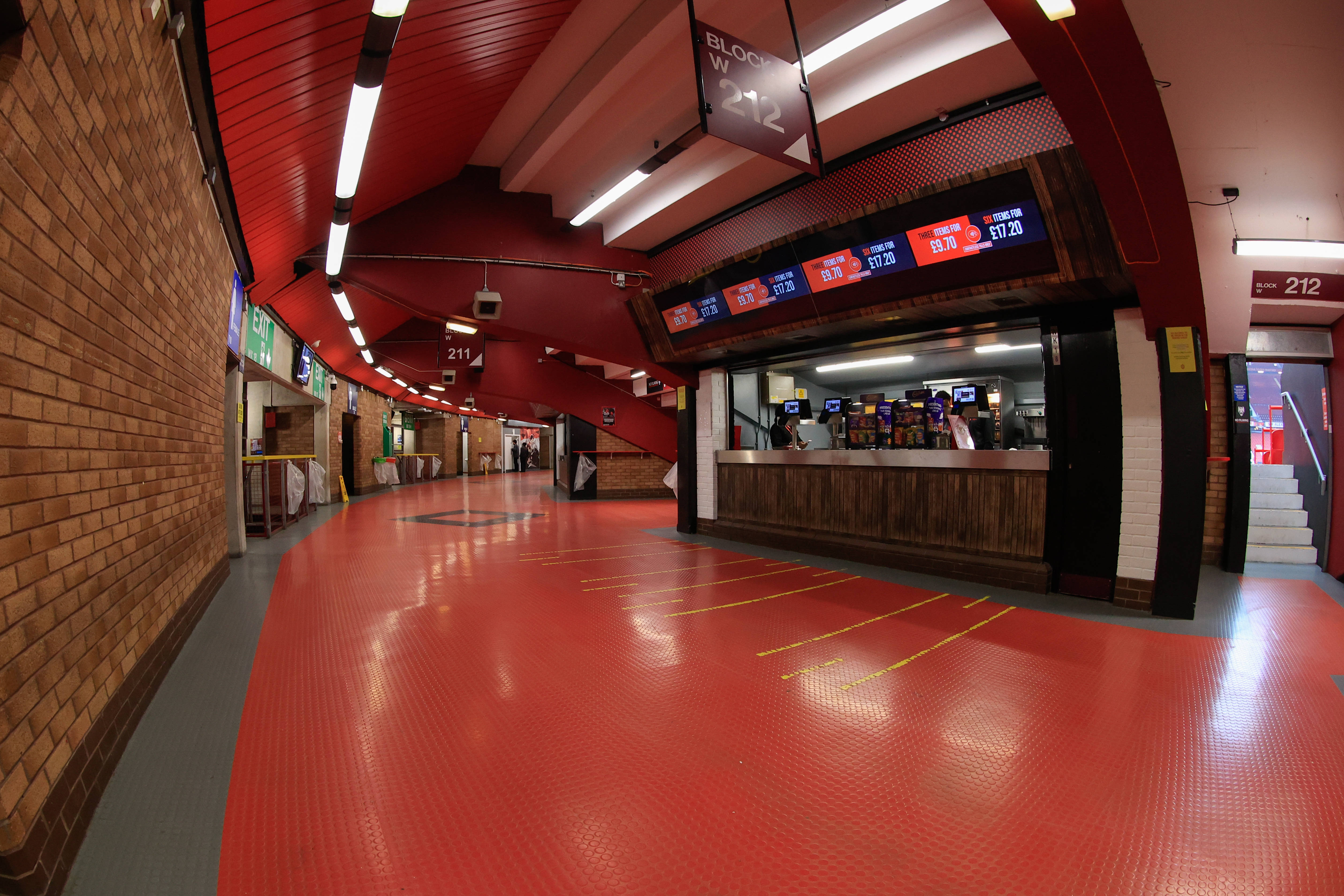 Old Trafford Facilities Guide 2026: Accessibility, Toilets, Food and Fan Experience 1 Fan concourse behind the Stretford End