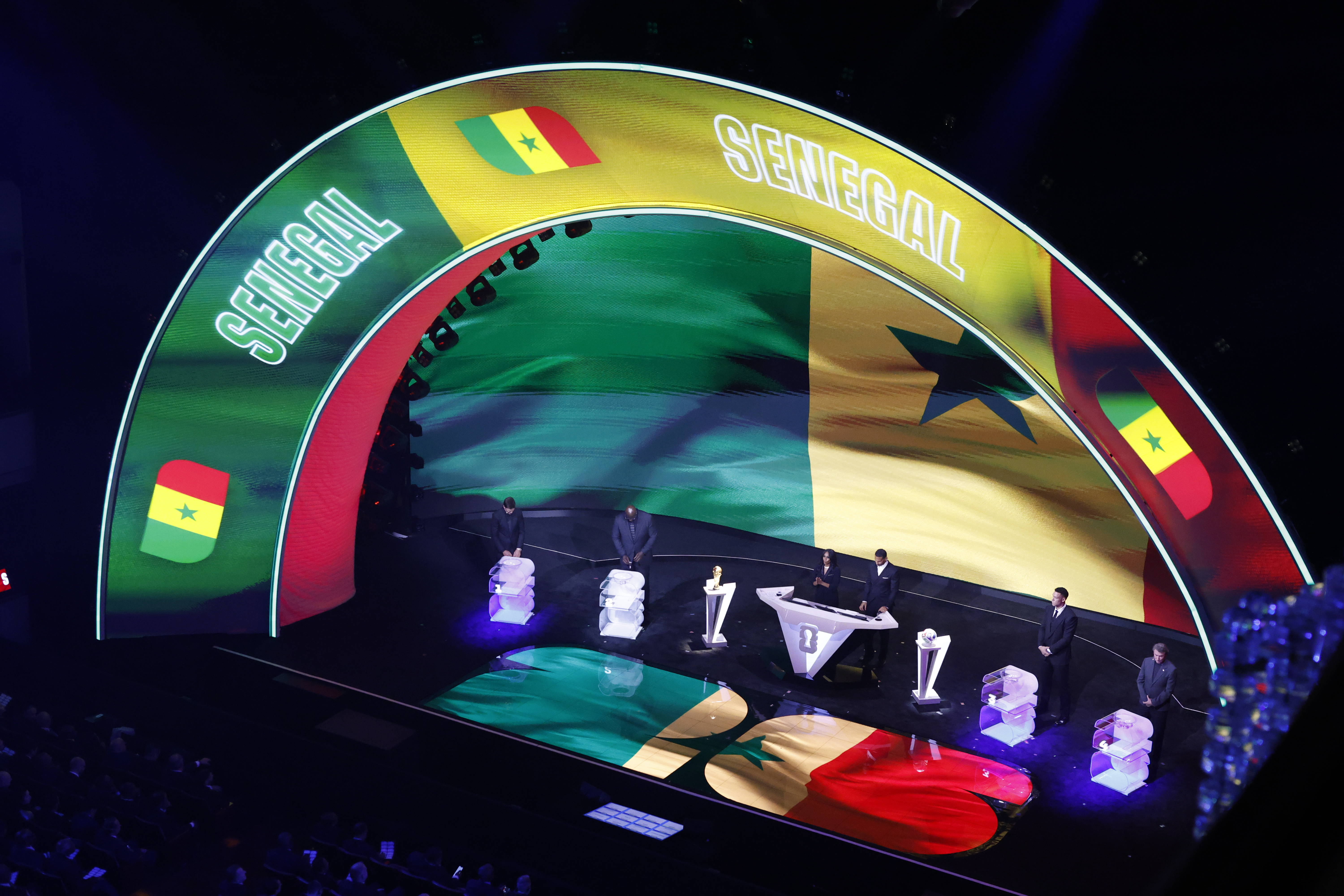 The Senegal flag is displayed on a screen during the draw for the 2026 FIFA World Cup