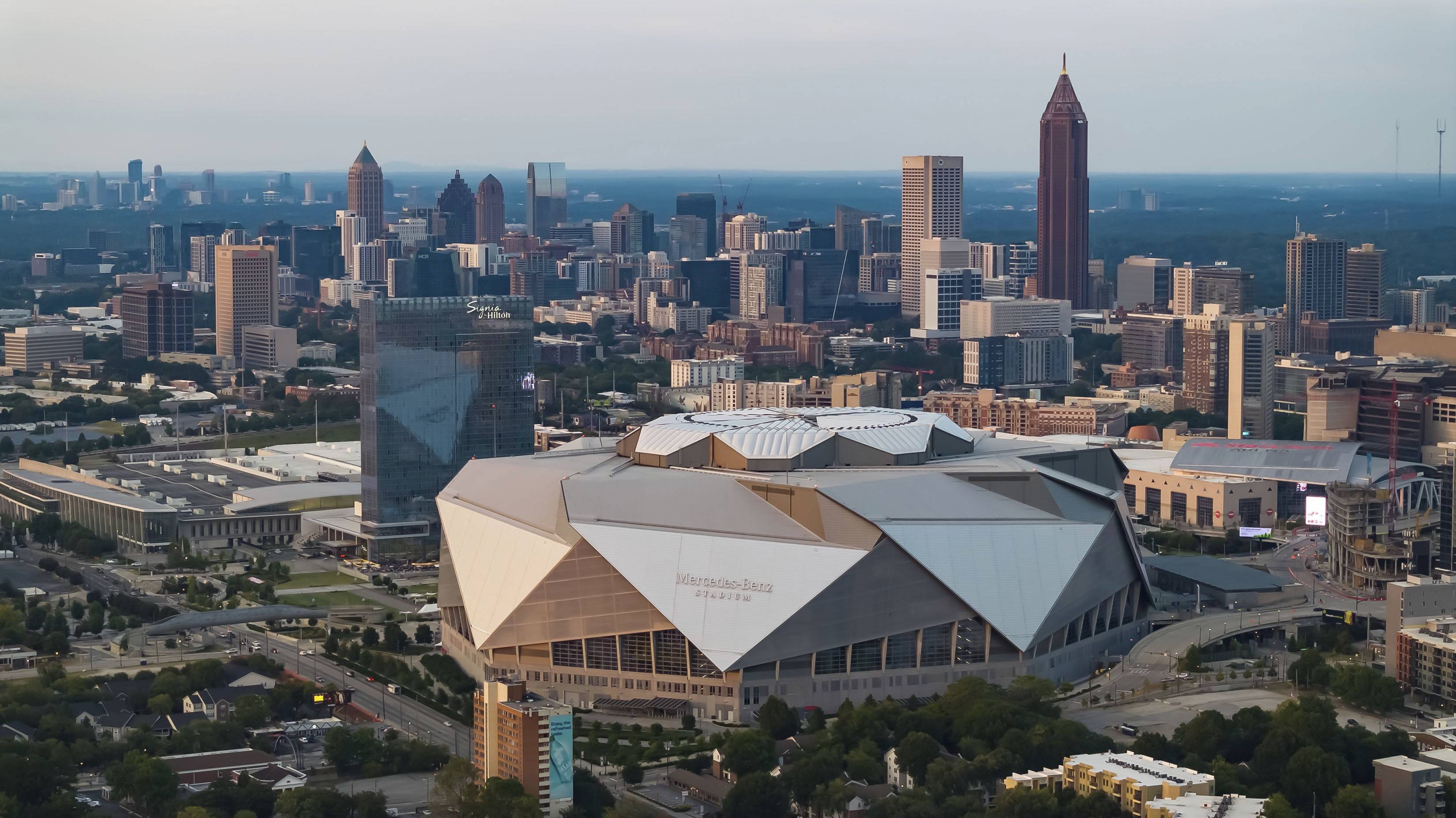 Aerial view of the Mercedes-Benz Stadium and roof logo